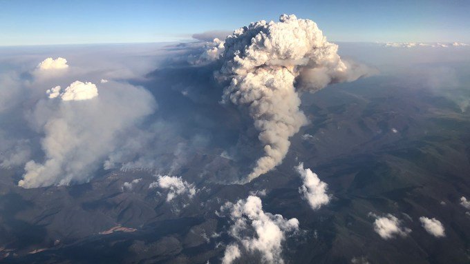 a huge column of smoke reaching into the stratosphere over Australia