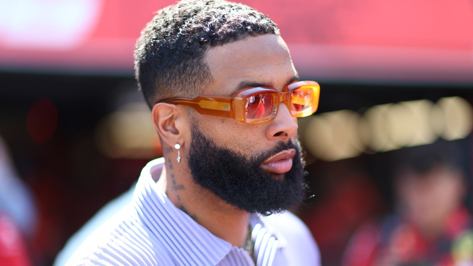 Image may contain Odell Beckham Jr. Head Person Face Adult Body Part Neck Accessories Glasses Crew Cut and Hair